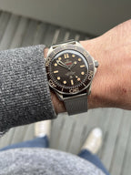 Omega Seamaster “007 Edition” Master Quality Watch – Black Dial, Bronze Gold-Tone Bezel & Stainless Steel Mesh Bracelet